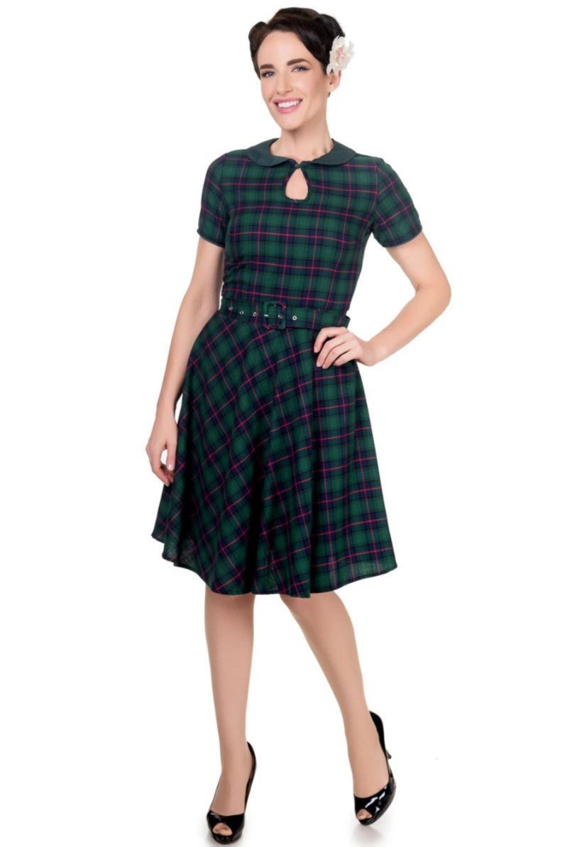 Model wearing Evelyn Retro Check Swing Dress in Green, front view