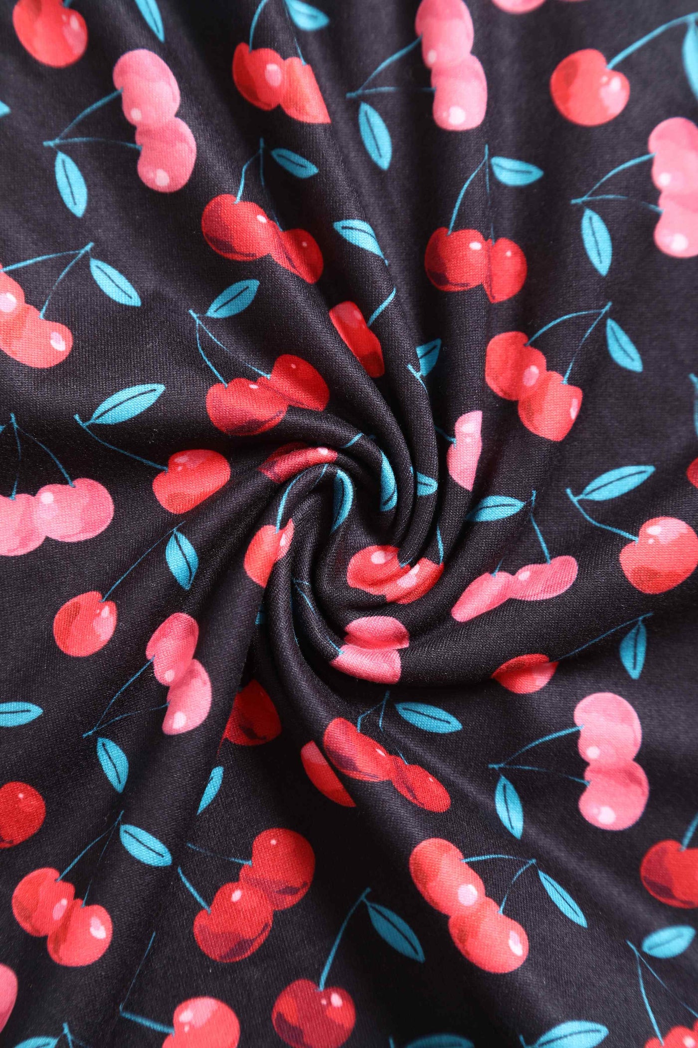 Close up View of Retro Cherry Print Crossover Bust Dress in Black