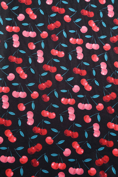 Close up View of Retro Cherry Print Crossover Bust Dress in Black