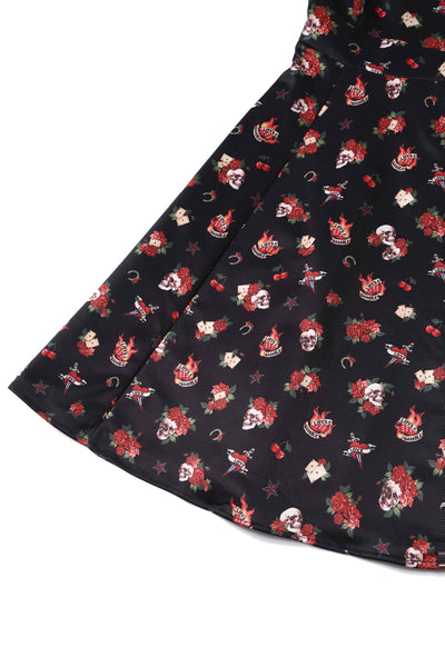 Close up view of Rockabilly Skull and Rose Print Dress in Black