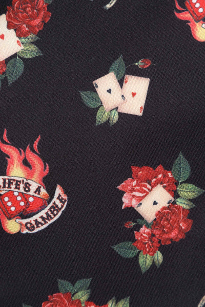 Close up view of Rockabilly Skull and Rose Print Dress in Black