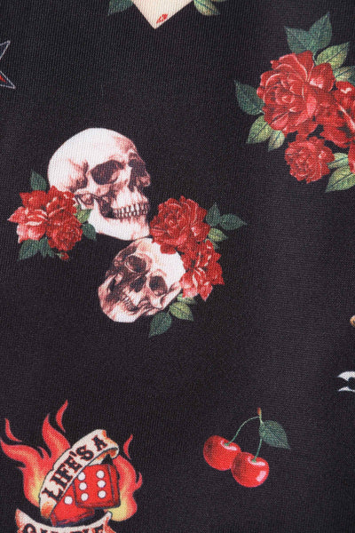 Close up view of Rockabilly Skull and Rose Print Dress in Black