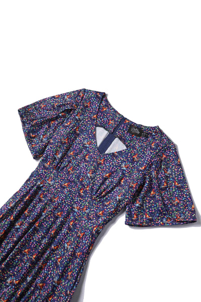 Short sleeved tea dress in purple rooster chicken and flowers print, top view