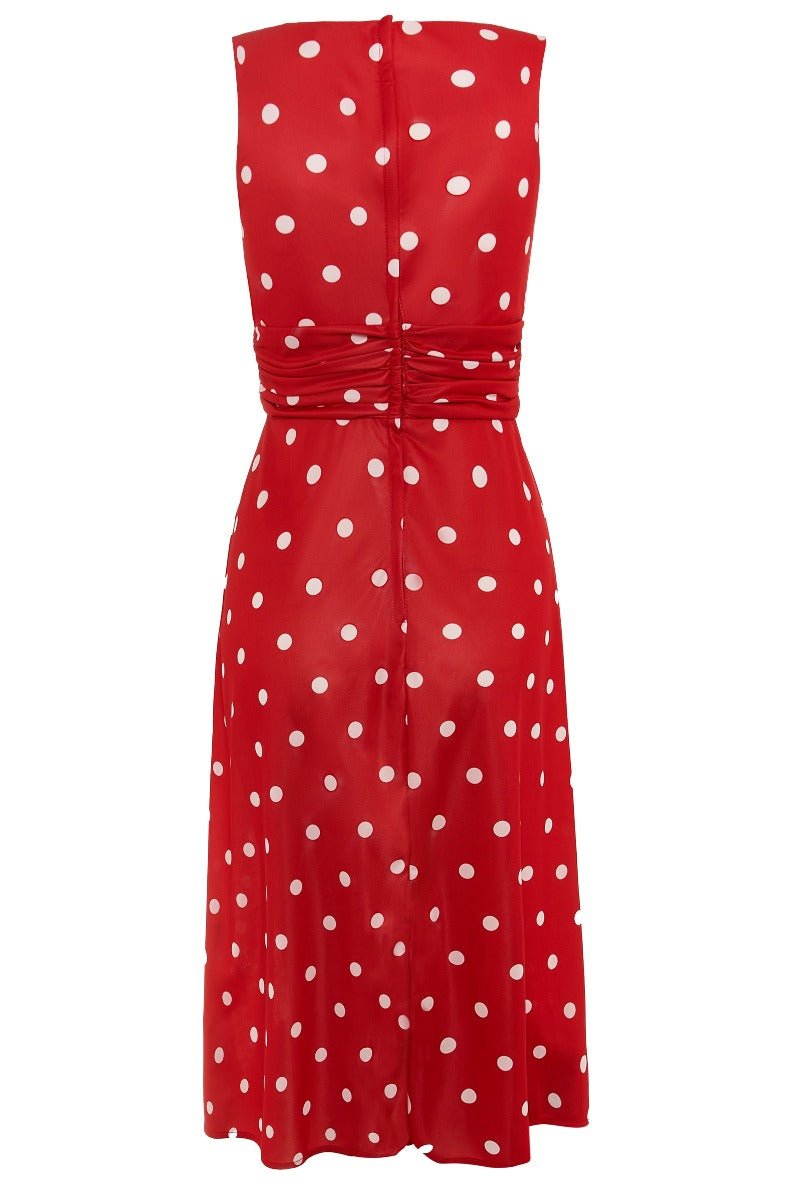 Bernice sleeveless swing dress in red, with white polka dots, back view