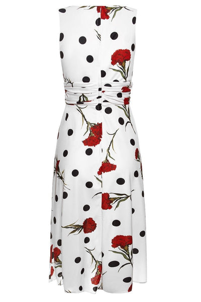 Bernice sleeveless swing dress in white, with black polka dot spots and red flowers, back view
