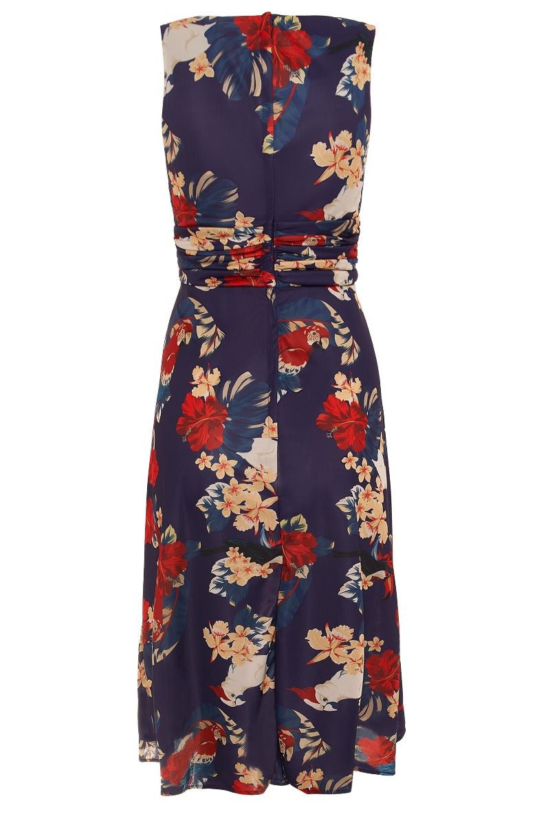 Bernice sleeveless swing dress in navy blue, with red and white flowers and parrots, back view