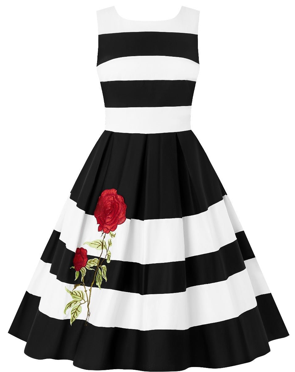 Black and white striped Annie swing dress, with embroidered red rose on the skirt, front view