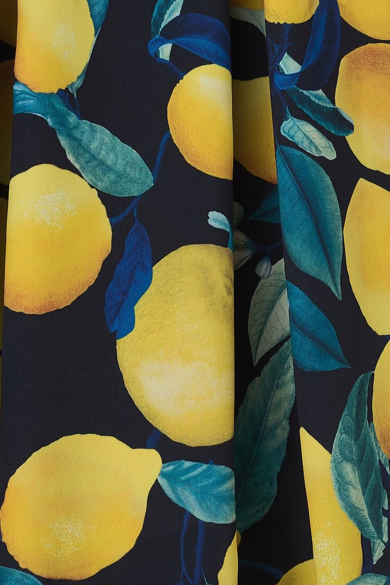 Annie Vintage Inspired Lemon Print Dress in Dark Blue with a Portrait Neckline &  Hidden Pockets