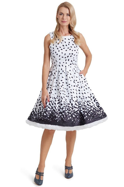 Model wearing our white Annie swing dress, with black brush strokes, front view