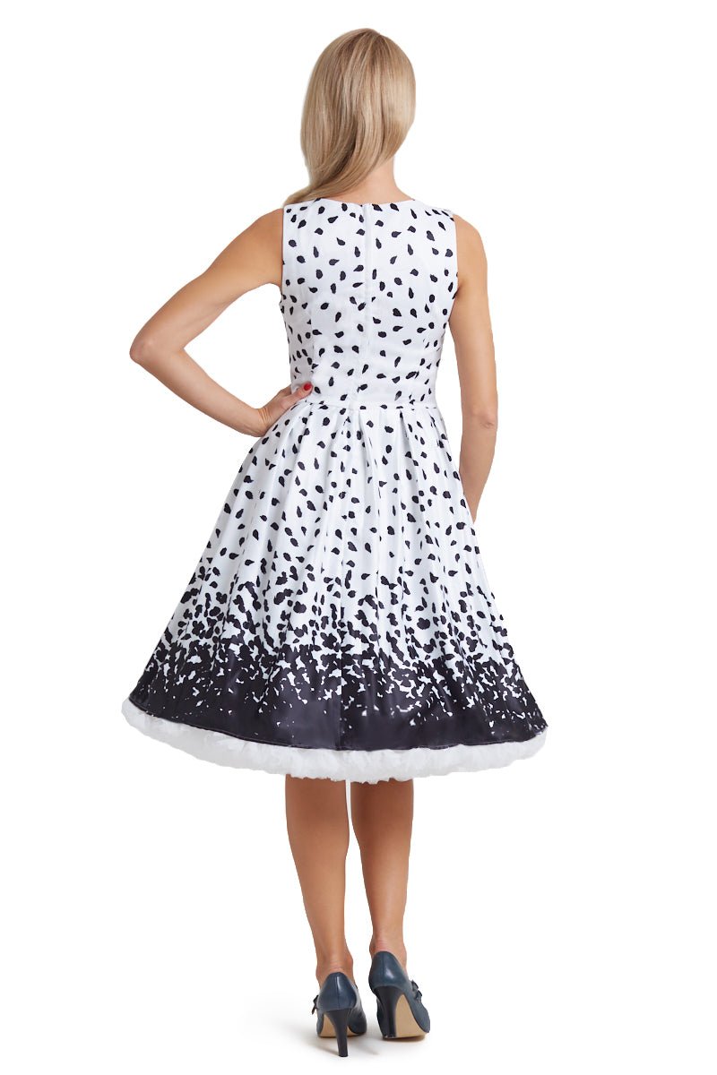 Model wearing our white Annie swing dress, with black brush strokes, back view