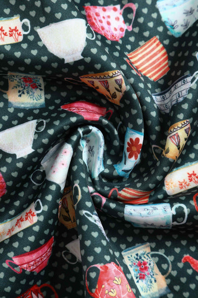 Close up View of Teacup and Teapot Pring Sleeveless Swing Dress in Green