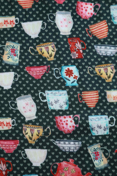 Close up View of Teacup and Teapot Pring Sleeveless Swing Dress in Green