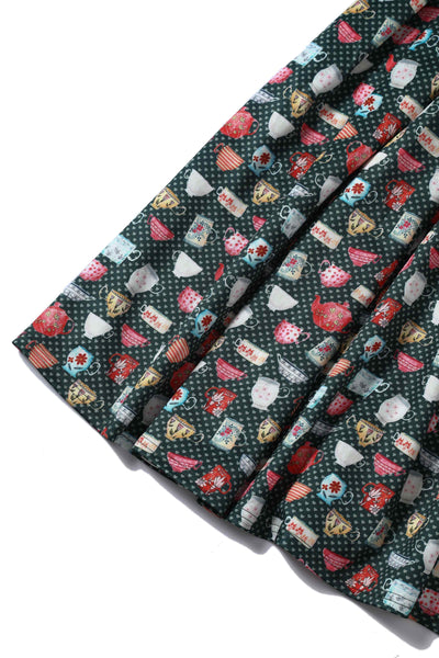 Close up View of Teacup and Teapot Pring Sleeveless Swing Dress in Green