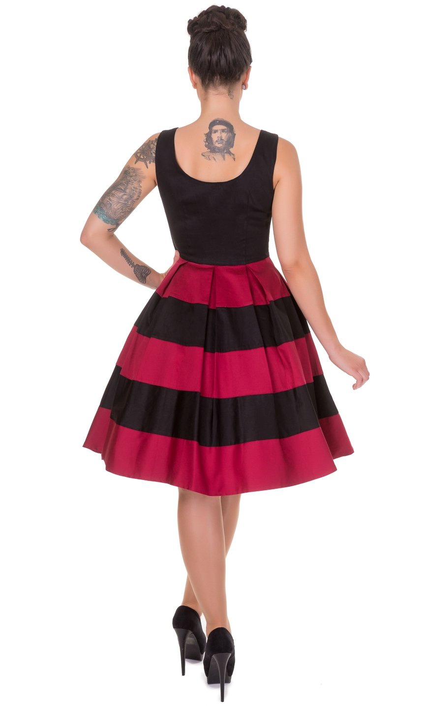 Model wearing black and red striped sleeveless dress, back view