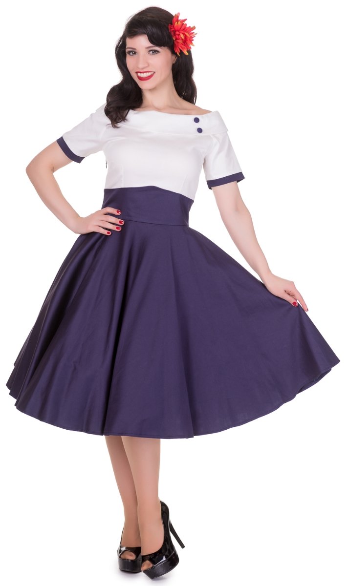 Model wearing Darlene dress in cream and navy blue, front view