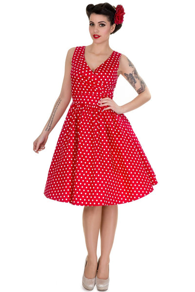 Model wearing our May crossover bust dress, in red/white polka dot print, front view