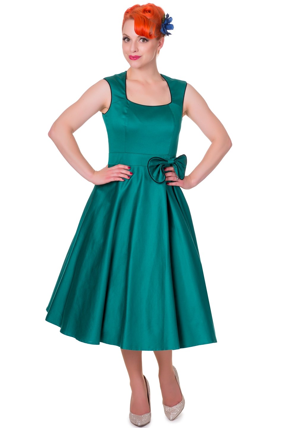 Model wearing our green Harriet dress, with bow, front view