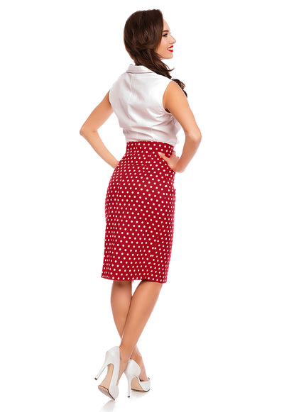 Model wearing our red and white polka dot pencil Falda skirt, with white top, back view