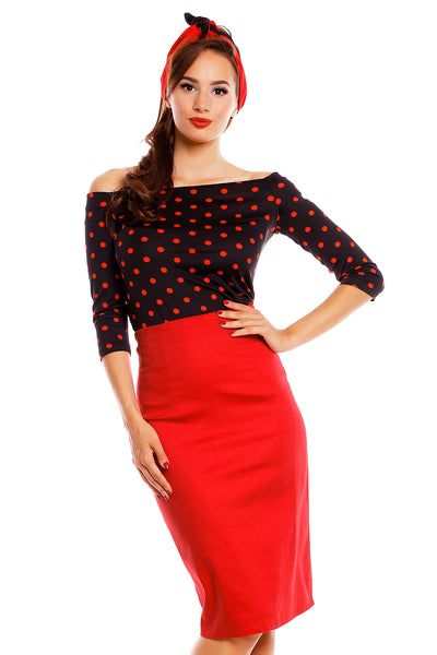 Model wearing our Gloria Rockabilly Top in Black/Red Polka Dots, with red skirt and headband, front view