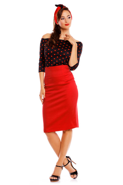 Model wearing our Gloria Rockabilly Top in Black/Red Polka Dots, with red skirt and headband, front view