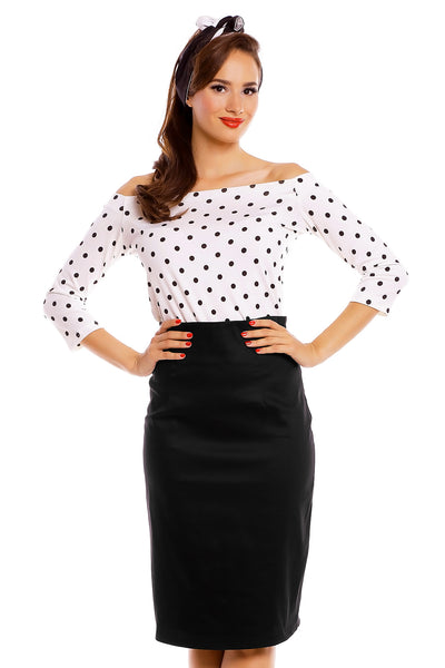 Model wearing our Gloria Rockabilly Top in White with black Polka Dots, with matching headband and skirt, front view