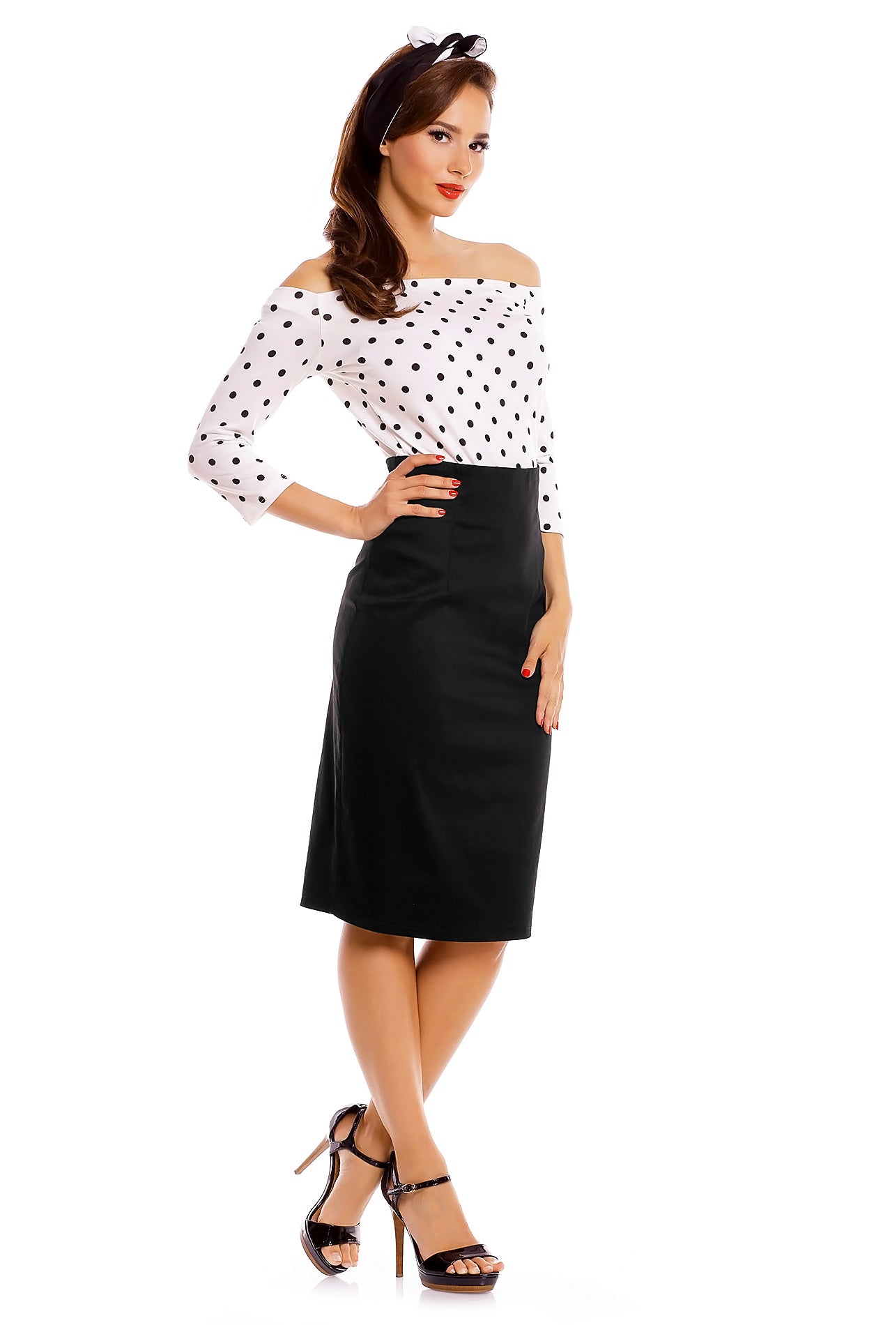 Model wearing our Gloria Rockabilly Top in White with black Polka Dots, with matching headband and skirt, side view