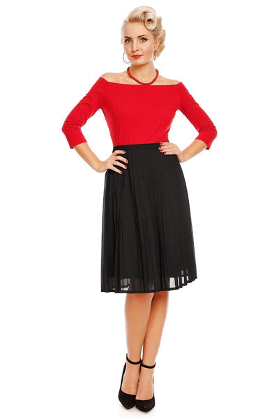Model wearing red off shoulder, long sleeve top, with black skirt, front view