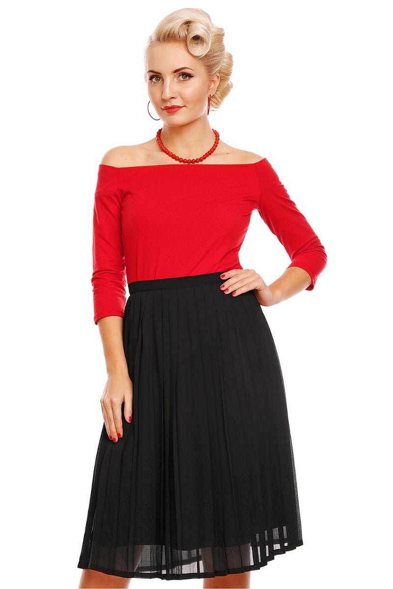 Model wearing red off shoulder, long sleeve top, with black skirt, front view