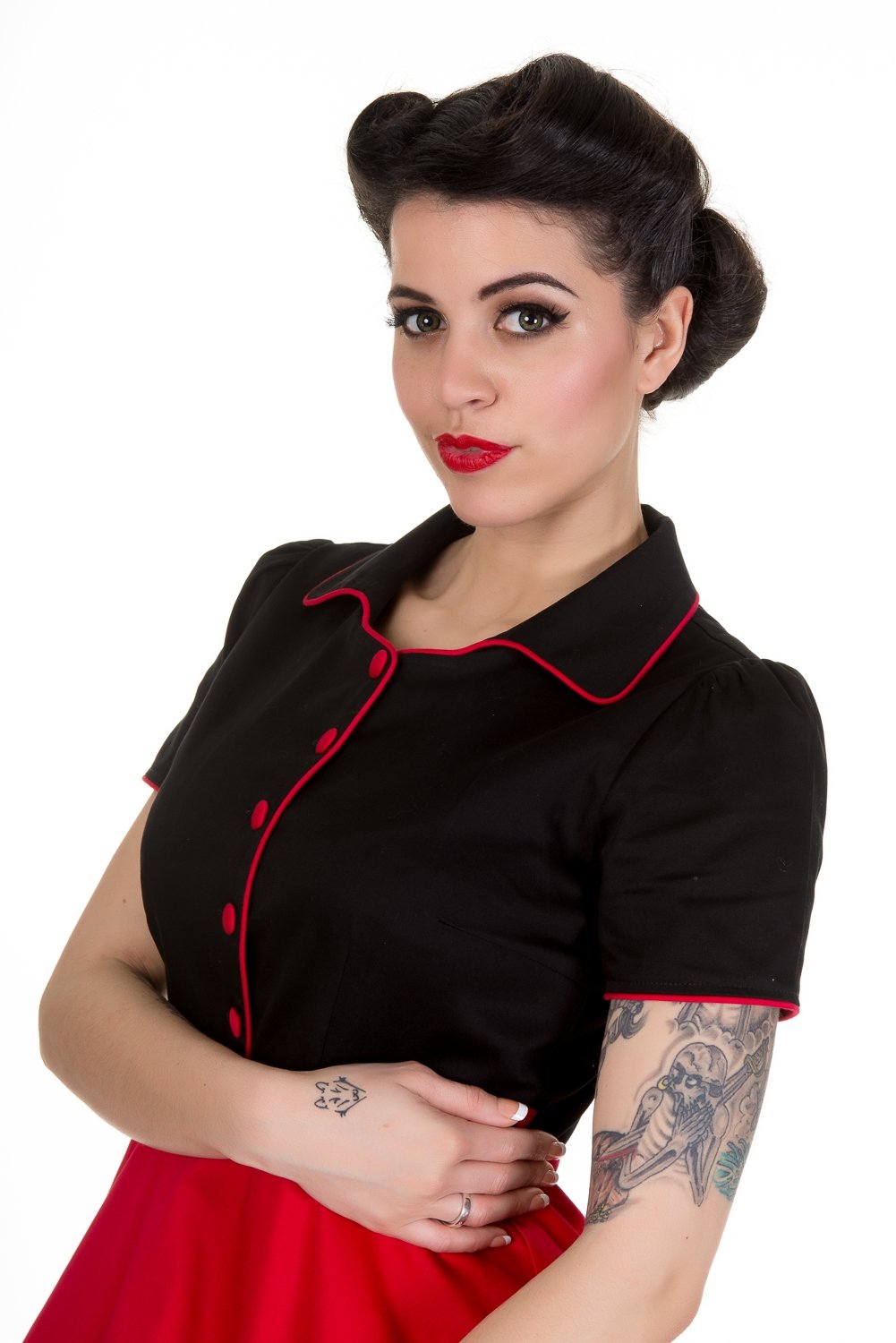 Model wearing our Penelope black and red diner dress, close up view