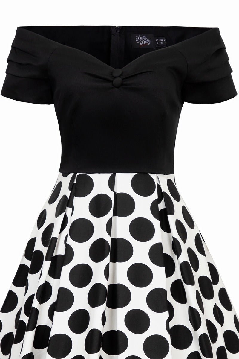 Black and white spot fit and flare dress close up