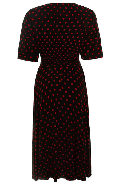 Matilda wrap casual dress, in black, with red polka dots, back view