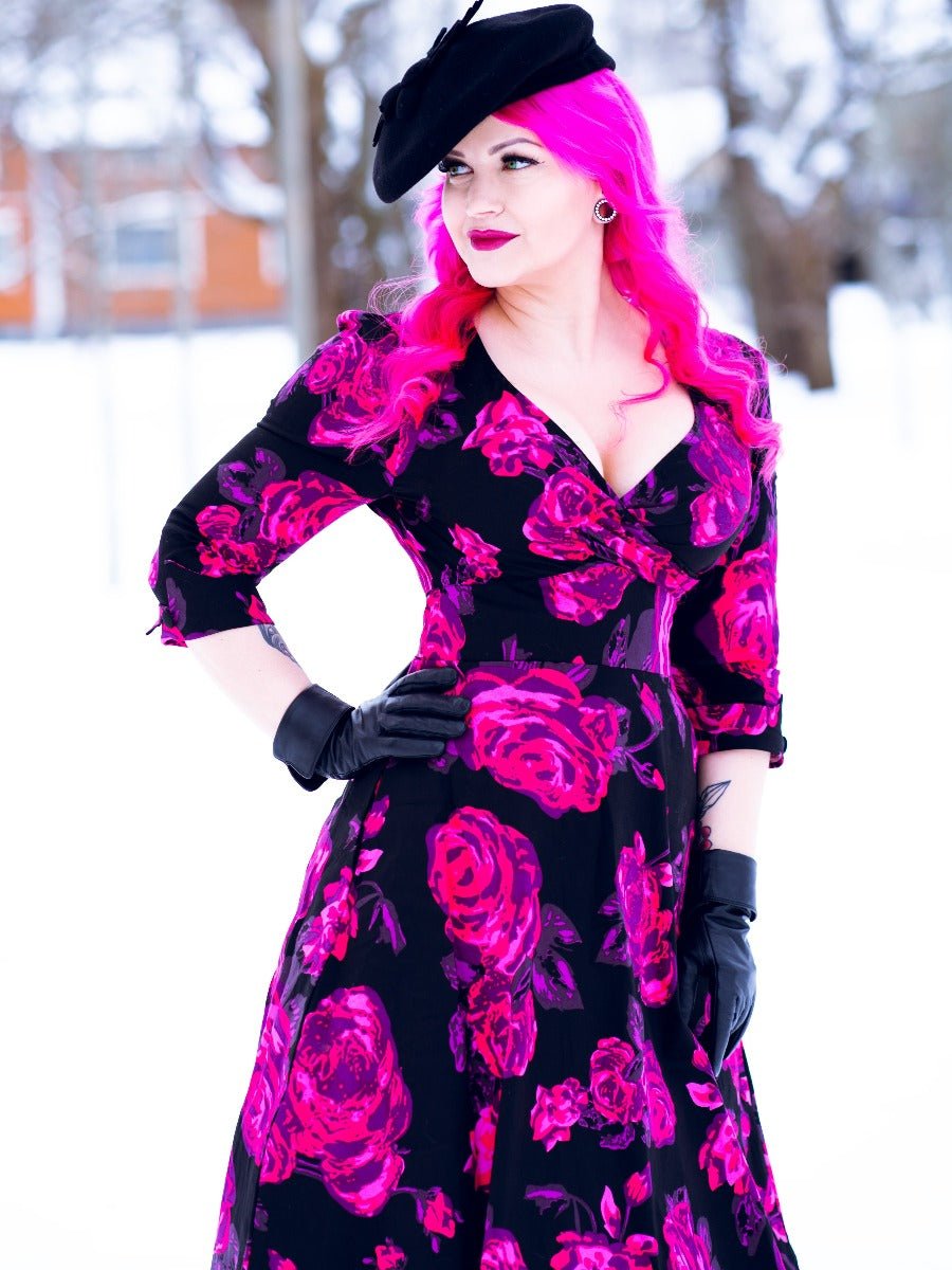 Influencer wearing v neck sleeved dress in black and pink floral print