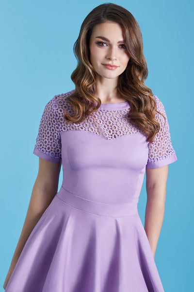 Model in lilac purple formal swing dress close up