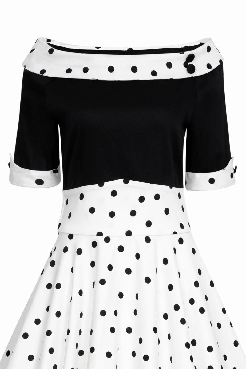 Black and white polka dot swing dress with sleeves close up