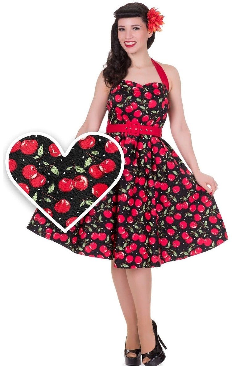 Model wearing halterneck cherry print dress in black and red