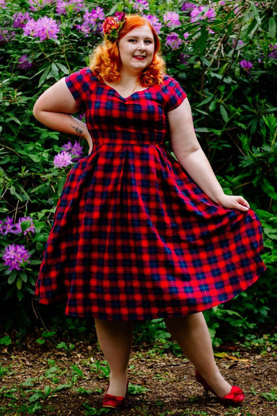 Influencer wearing red and blue tartan swing dress