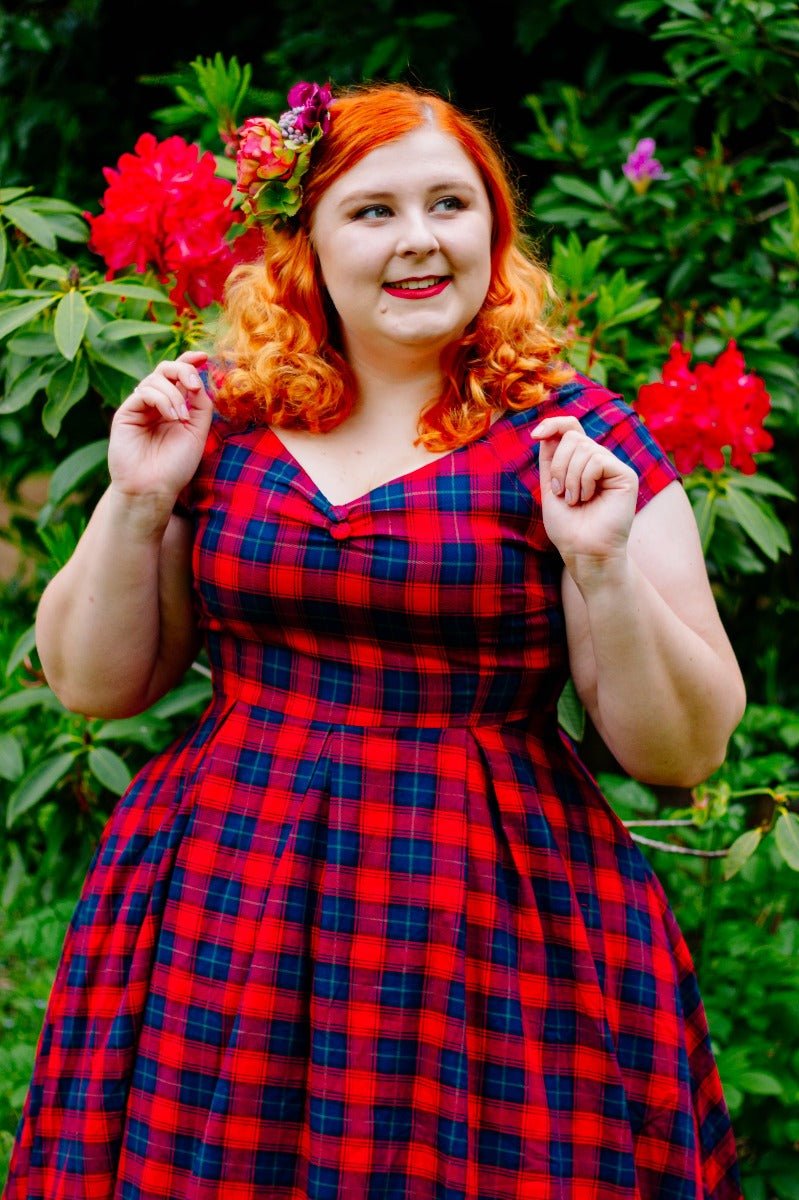 Influencer wearing red and blue tartan swing dress