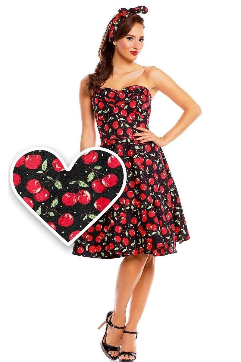 Model wearing strapless black red cherry print dress