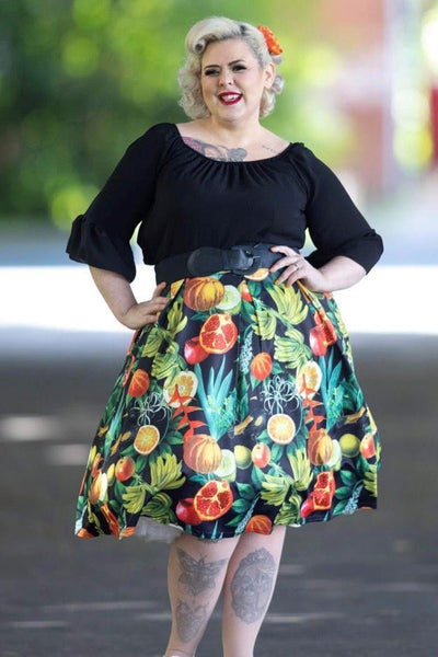Influencer wearing tropical fruit print flared skirt with petticoat