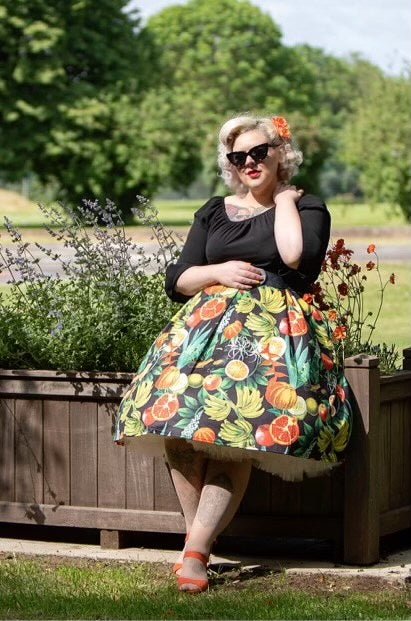Influencer wearing tropical fruit print flared skirt with petticoat