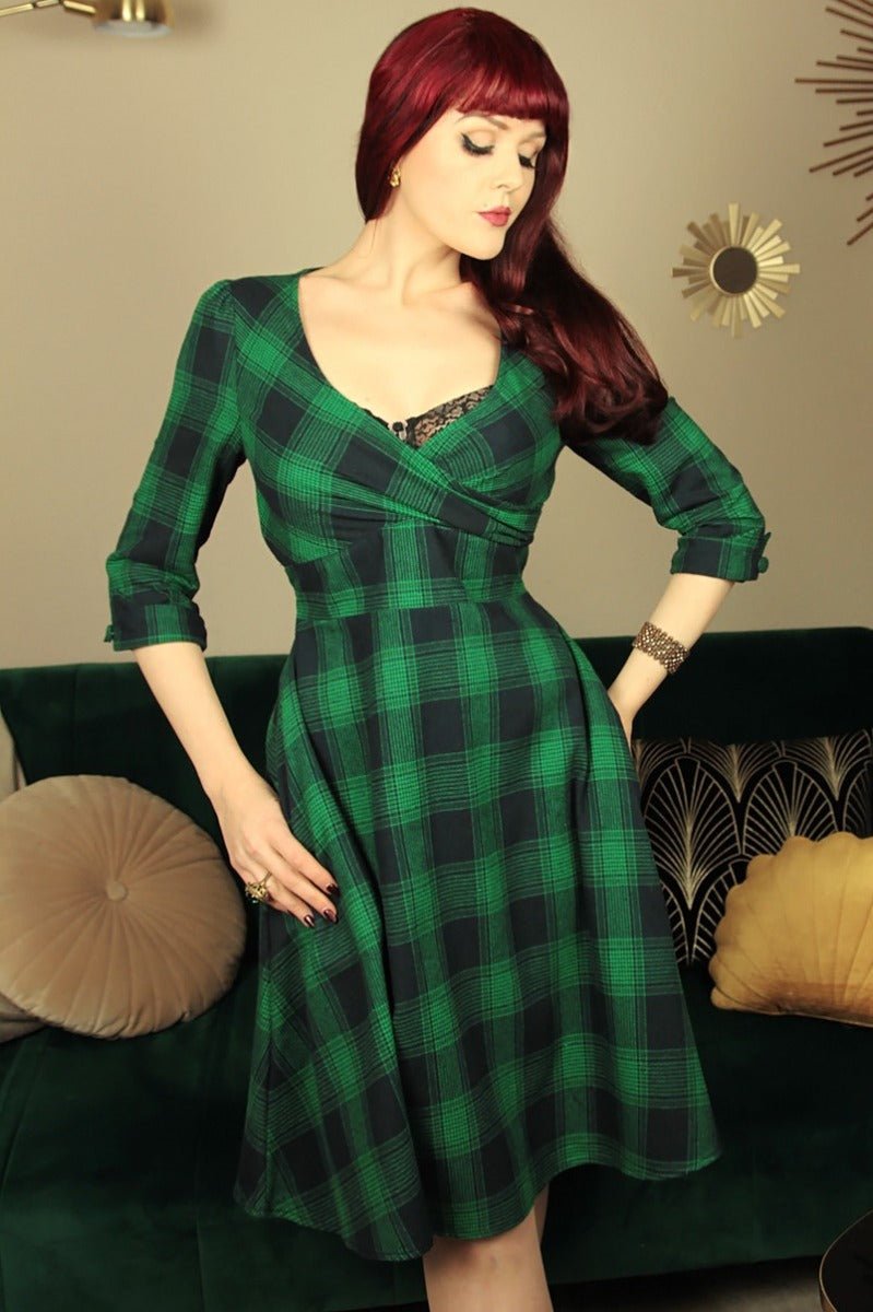 Influencer wearing green blue tartan sleeved swing dress