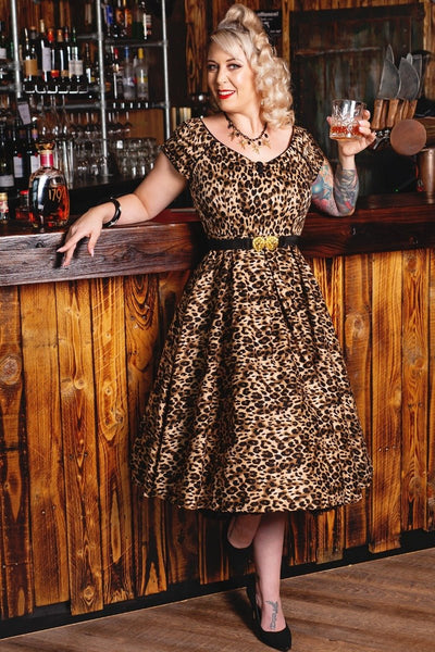 Influencer wearing brown leopard print short sleeve swing dress