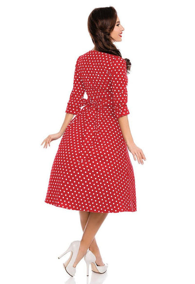 Model wearing red sleeved dress with white polka dots back