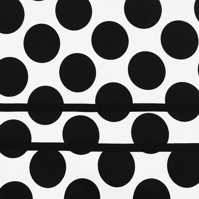 white fabric with large black spots and stripes swatch
