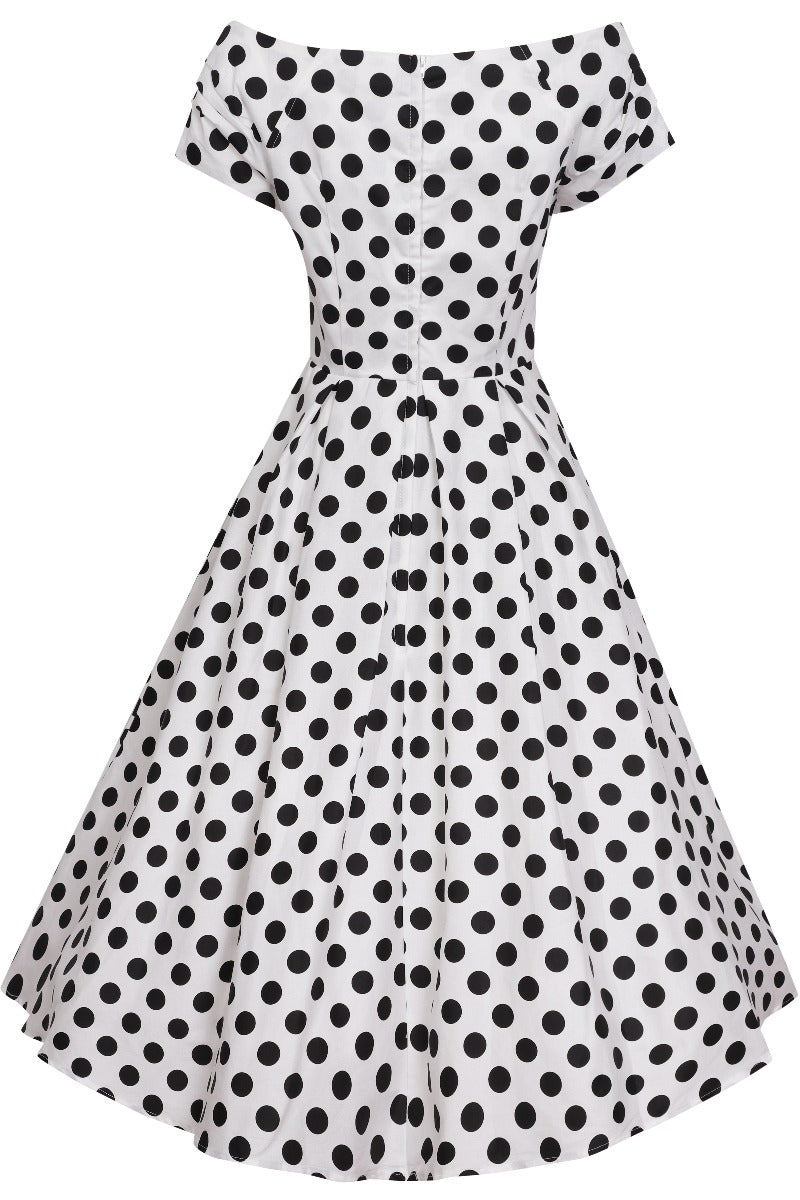 Back view of our V neck, off-shoulder dress, in white and black polka dot spot print