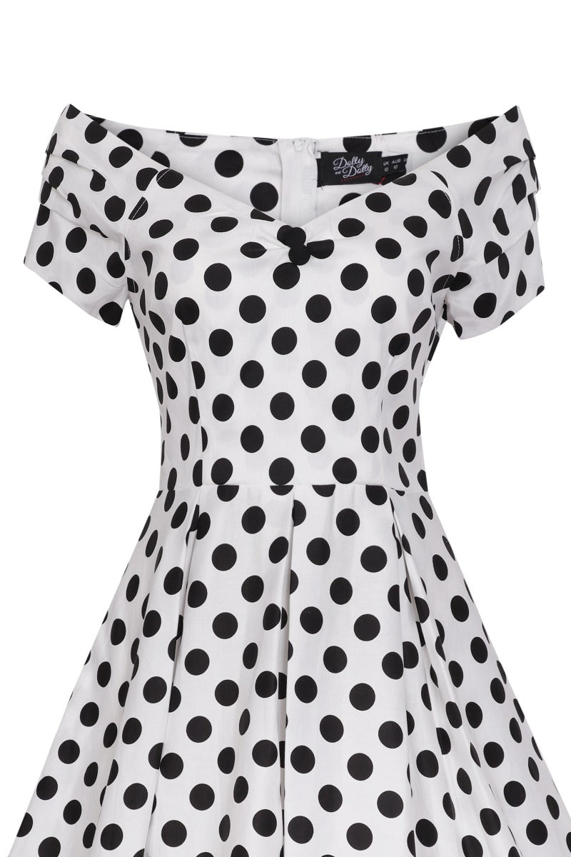 Top view of our V neck, off-shoulder dress, in white and black polka dot spot print