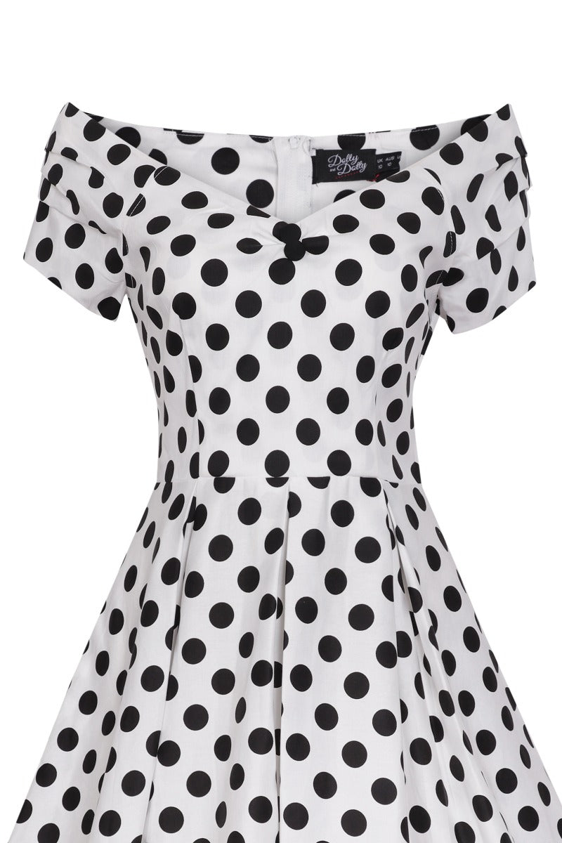 Top view of our V neck, off-shoulder dress, in white and black polka dot spot print