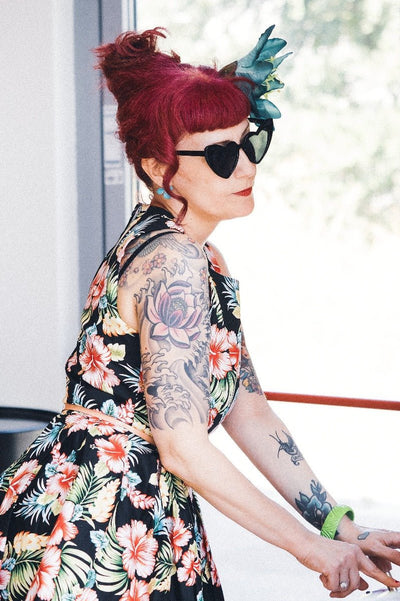 Women wearing our Annie dress, in black/pink orchid floral print, looking stylish