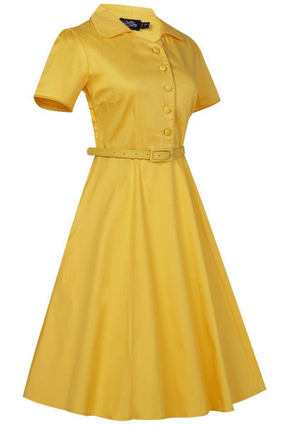 Short sleeved button top dress, in plain yellow, with belt, side view