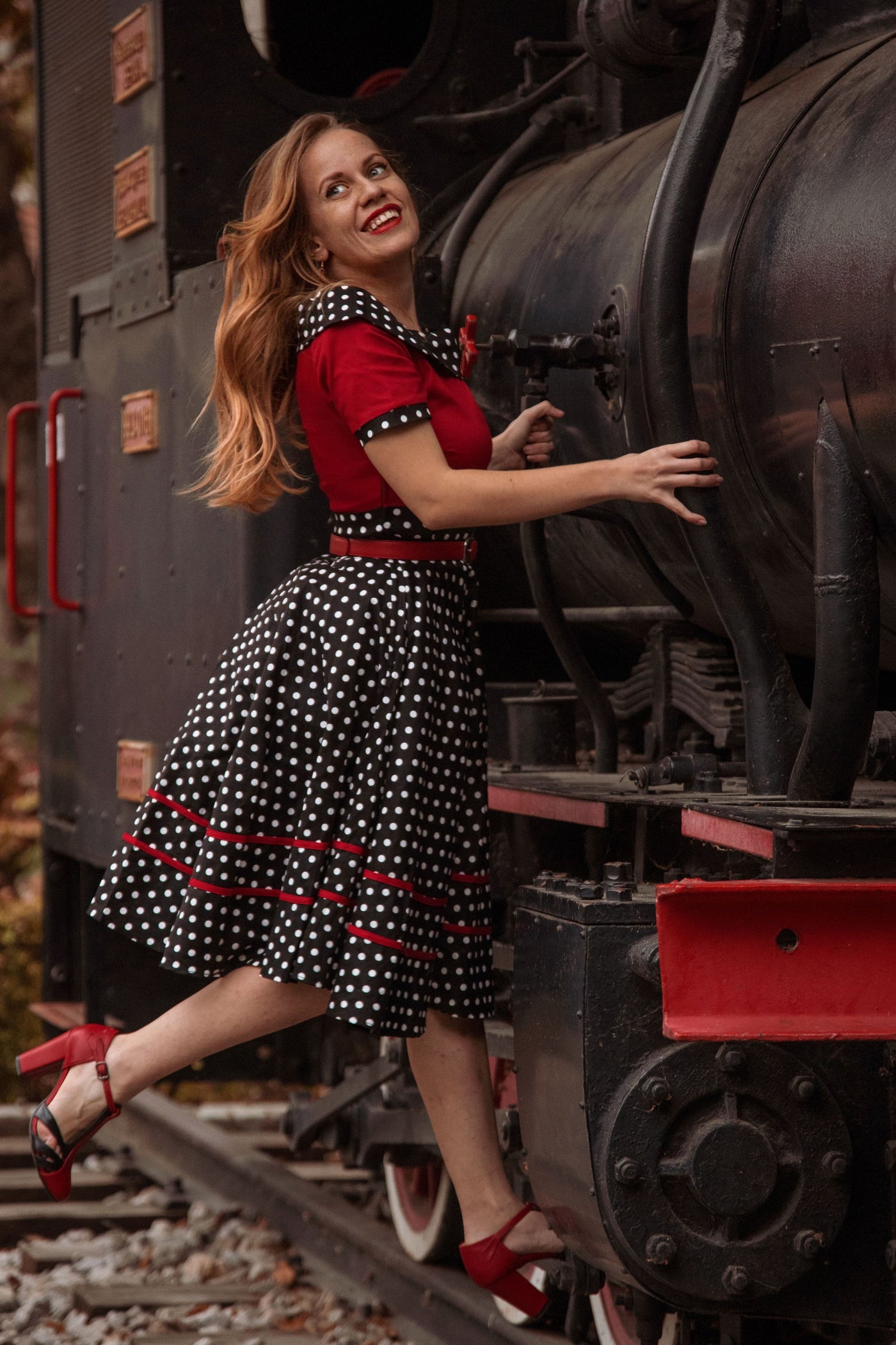 zmajin.svet wearing Rockabilly Red & Black White Polka Dot Off Shoulder Circle Dress at the train station